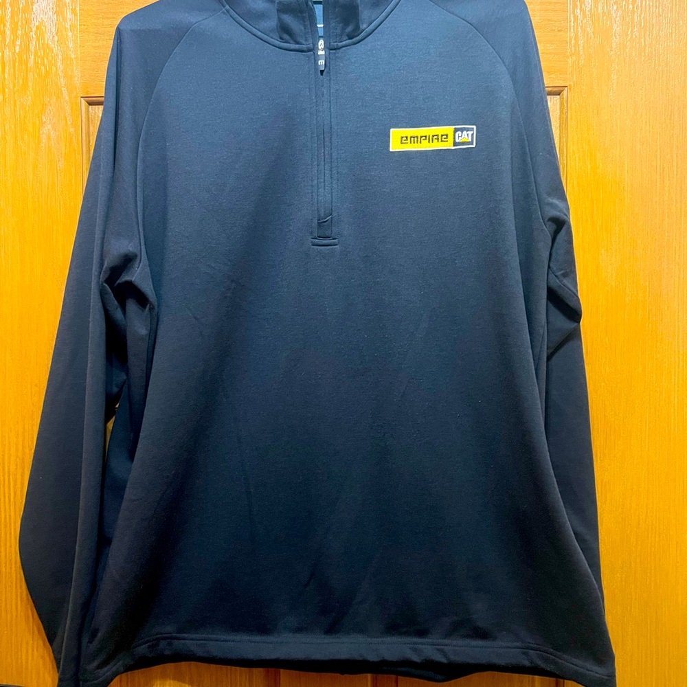 CAT logo Travis Mathew’s pull over